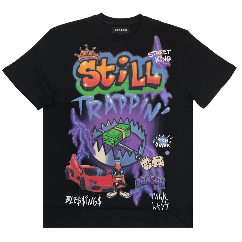 Men's black "Still Trappin" tee. Sizes Medium,  and Large.